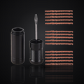 Tubeless tire repair kit with aluminum storage canister, fork insertion tool and rubber plug strips on premium dark studio background